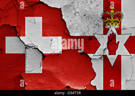 flags of Northern Ireland and Switzerland painted on cracked wall Stock ...