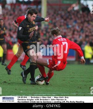 19.03.94. Swindon v Manchester United. Manchester United's Eric Cantona tangles with Swindon's John Moncur in the incident which led to Cantona's sending off Stock Photo