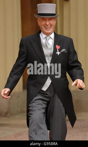 BBC Radio 2 veteran DJ Johnnie Walker laughs in the quadrangle of Buckingham Palace in London, Thursday 24 Febuary 2006, after collecting an MBE for services to broadcasting from the Prince of Wales. See PA Story ROYAL Investiture. PRESS ASSOCIATION Photo. Photo credit should read: Fiona Hanson/WPA/PA Stock Photo