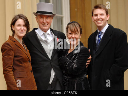 BBC Radio 2 veteran DJ Johnnie Walker with his third wife Tiggy (centre), son Sam, 31, and daughter Beth, 29, in the quadrangle of Buckingham Palace in London, Friday 24 Febuary 2006, after collecting an MBE for services to broadcasting from the Prince of Wales. See PA Story ROYAL Investiture. PRESS ASSOCIATION Photo. Photo credit should read: Fiona Hanson/WPA/PA Stock Photo