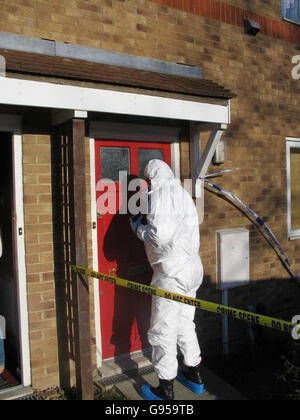 A police forensic officer searches a house in Lambersart Close, near Southborough in Kent, Sunday February 26, 2006, as the search for the Securitas depot robbers continues. Detectives investigating the multi-million pound raid today said they had carried out a 'number of raids' overnight as the net closes in on the robbers. Kent Police also said it had made a sixth arrest in connection with the inquiry. The man aged 49, who was held yesterday, was later released on bail. See PA story POLICE Robbery. PRESS ASSOCIATION photo. Photo credit should read: Matt Adams/PA. Stock Photo