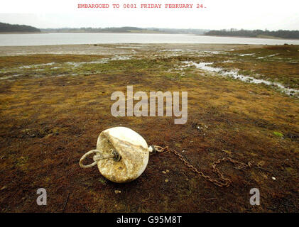 A disused buoy litters the edge of Bewl Water near Lamberhurst in Kent, as the reservoir remains at only a third full. Water companies in south-east England should introduce hosepipe bans next month to avoid the prospect of standpipes, as the region is gripped what could be the worst drought in 100 years, the Environment Agency said Friday February 24, 2006. Watch for PA Story ENVIRONMENT Drought. PRESS ASSOCIATION Photo. Photo credit should read: Gareth Fuller/PA. NOTE TO EDITORS - Photo was taken Wednesday February 22. Stock Photo