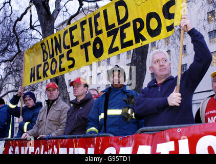 Firefighters from stations in and around Hertfordshire join a protest outside Downing Street, London, Wednesday March 1, 2006, as a reception is held in Downing Street to thank emergency services. The Fire Brigades Union said the demonstration highlighted its opposition to proposals to close two fire stations and cut jobs across Hertfordshire, where the Buncefield oil depot incident happened last December. See PA Story INDUSTRY Fire. PRESS ASSOCIATION Photo. Photo credit should read: Ian Nicholson/PA. Stock Photo