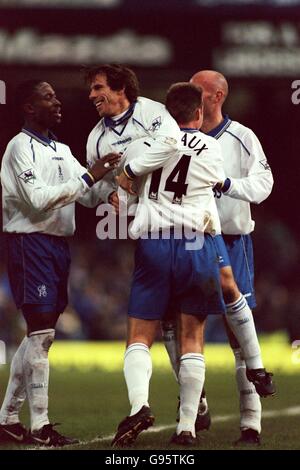 Chelsea's Gianfranco Zola (second left) celebrates scoring their fourth goal with teammates Celestine Babayaro (left), Graeme Le Saux (second right) and Frank Leboeuf (right) Stock Photo