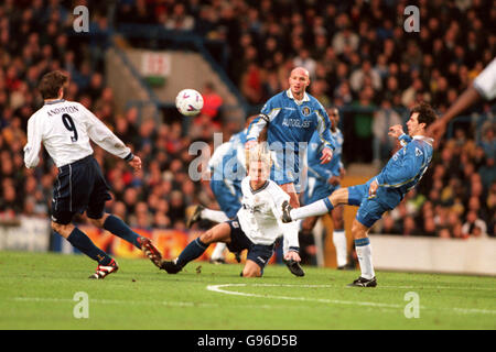 Chelsea's Gianfranco Zola clears the ball as Tottenham Hotspur's Allan Nielsen is tackled by Chelsea's Frank Leboeuf Stock Photo