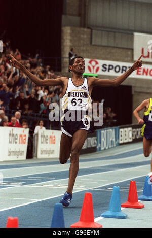 Athletics - BUPA Indoor Grand Prix - Birmingham. Ethiopia's Haile Gebrselassie celebrates breaking the world indoor 5000m record as he crosses the line Stock Photo