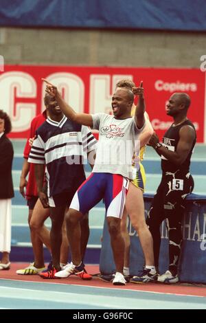 Athletics - BUPA Indoor Grand Prix - Birmingham. Kriss Akabusi, a competitor in the Malysia Airlines Legends of the Track 60m, fools around at trackside as he is introduced to the crowd Stock Photo