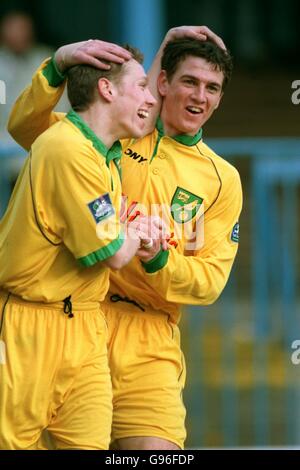 Norwich City's Craig Bellamy celebrates his goal with team mate Chris Llewellyn Stock Photo