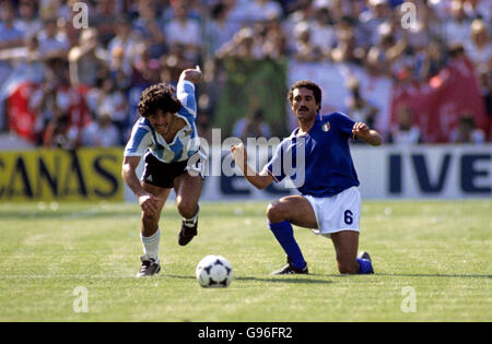 Soccer - World Cup Spain 1982 - Group C - Argentina v Italy. Argentina's Diego Maradona (left) gets away from Italy's Claudio Gentile (right) Stock Photo