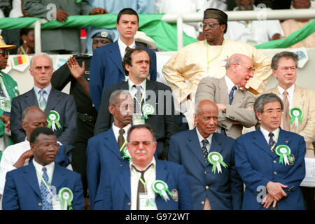 From left - Franz Beckenbauer, Michel Platini and Sir Bobby Charlton and Tony Banks MP watch the FIFA World Youth Championships in Nigeria Stock Photo