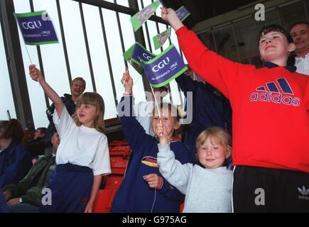 Athletics - CGU Gateshead Classic. Young spectators waving CGU flags Stock Photo