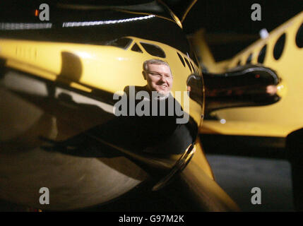 The image of Scottish Health Minister Andy Kerr is reflected in the propeller of one of two new purpose built King Air 200c aircraft at Edinburgh Airport, Monday March 20, 2006, that will form an integral part of a new world class air ambulance service for Scotland. With a range of nearly 1,700 miles, a top speed of 289 knots and space for two stretchers, they are due to start operating out of Glasgow and Aberdeen from April 1. See PA Story SCOTLAND Ambulance. PRESS ASSOCIATION Photo. Photo credit should read: Andrew Milligan/PA. Stock Photo