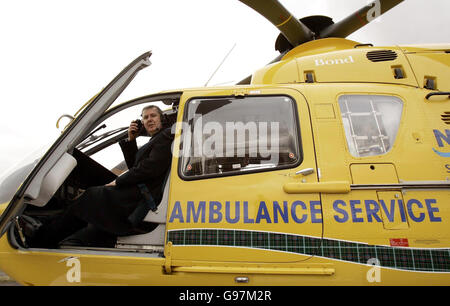 Scottish Health Minister Andy Kerr sits inside the cockpit of an EC135 Eurocopter helicopter at Edinburgh Airport, Monday March 20, 2006, on the day he formally took delivery of two fixed wing King Air 200c air ambulances that will form an integral part of a new world class air ambulance service for Scotland. With a range of nearly 1,700 miles, a top speed of 289 knots and space for two stretchers, they are due to start operating out of Glasgow and Aberdeen from April 1. See PA Story SCOTLAND Ambulance. PRESS ASSOCIATION Photo. Photo credit should read: Andrew Milligan/PA. Stock Photo