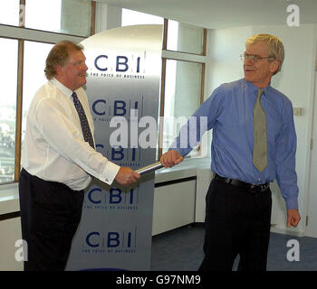 Out-going CBI Director General Sir Digby Jones hands over the baton to the new director, Richard Lambert at the CBI HQ in London, Thursday March 23, 2006. Mr Lambert, 61, the former editor of the Financial Times, will take over as Director-General of the CBI in July after beating hundreds of other candidates for the job. He admitted today it would be a difficult task to take over from Sir Digby who is stepping down after more than six years in the post. See PA Story INDUSTRY CBI. PRESS ASSOCIATION Photo. Photo credit should read: Michael Stephens/PA. Stock Photo