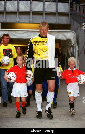 Soccer - Friendly - Denmark v Holland. Denmark goalkeeper Peter Schmeichel walks out with two mascots, one wearing Manchester United kit Stock Photo