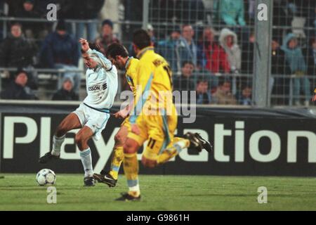 Olympique Marseille's Robert Pires (left) takes on Lazio's Giuseppe Favalli (hidden) Stock Photo