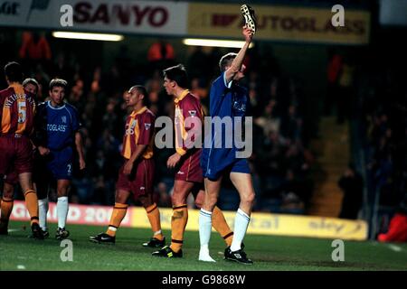 Soccer - FA Carling Premiership - Chelsea v Bradford City. Chelsea's Tore Andre Flo celebrates his goal as dejected Bradford City players walk by. Stock Photo