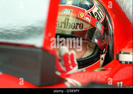 Formula One Motor Racing - Malaysian Grand Prix - Practice. Michael Schumacher watches the times during practice Stock Photo