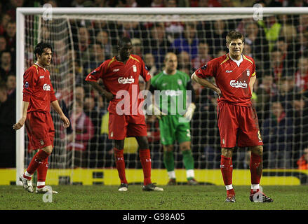 Liverpool's (from L-R) Luis Garcia, Djimi Traore, Jose Reina and Steven Gerrard show thier dejection after Benfica's goal during the UEFA Champions League second round, second leg match at Anfield Stadium, Liverpool, Wednesday March 8, 2006. PRESS ASSOCIATION Photo. Photo credit should read: Peter Byrne/PA. Stock Photo