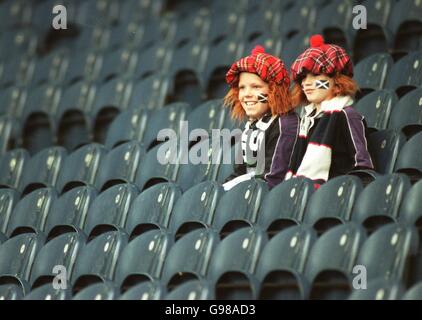 Rugby Union - Rugby World Cup 99 - Pool A - Scotland v Spain. Two youngsters enjoying Scotland's game against Spain despite another very low turnout for the home team's campaign Stock Photo