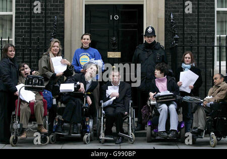 Adults with communication impairments and representatives from Scope deliver a petition to Downing Street demanding that communication equipment is made available for those in need, Tuesday 28 March 2006. Abigail Lock, Parliamentary Affairs Officer at Scope, said, 'The importance of communication cannot be underestimated. We want a commitment to provide a comprehensive, joined-up service that includes adults and pre-school children. Without this, Government is simply writing off people with communication impairments.' PRESS ASSOCIATION photo. Photo Credit should read : Rebecca Reid/PA Stock Photo