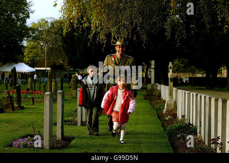 Col. Darren Naumann of the Australian Army with his children Jonathan, 8, and Emily, 5, in the Australian Army plot in Grangegorman Millitary Cemetery in Dublin during the dawn Anzac Day memorial service. Stock Photo