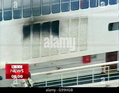 We are advised that video-grabs should not be used by daily papers later than 48 hours after the broadcast of the programme, without consent of the copyright holder. ALL TV AND INTERNET OUT. Videograbbed image taken from the BBC News 24 of fire damage on the cruise ship Calypso. PRESS ASOCIATION Photo. Issue date: Saturday May 6 2006. A blaze aboard the ship in the English Channel sparked a full-scale alert early today. The fire broke out at 3.47am on board the Calypso, which was carrying 708 people on board, near Beachy Head. Firefighters flew out to the ship, reported to be about 20 miles Stock Photo