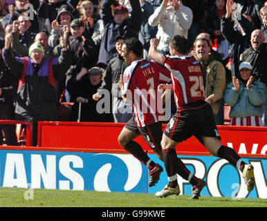 Sheffield United's Paul Ifill (L) celebrates his goal in front of the home fans with David Unsworth during the Coca-Cola Championship match against Hull at Bramall Lane, Sheffield, Saturday April 8, 2006. Stock Photo