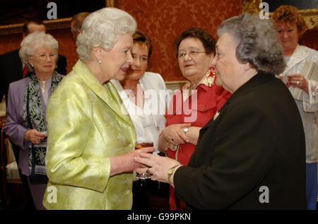 Britain's Queen Elizabeth II chats with Doreen O'Leary from Shropshire, (right) during the 80th birthday lunch held by The Queen at Buckingham Palace. Stock Photo
