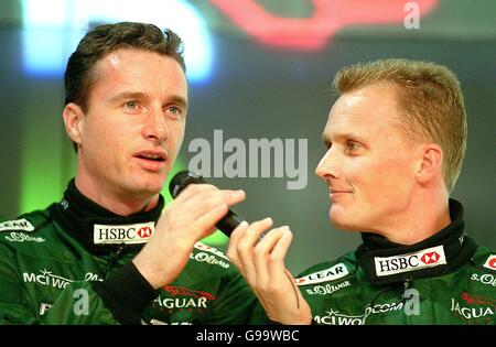 Formula One Motor Racing - Jaguar Launch - Lord's. Eddie Irvine (l) chats to new Jaguar teammate Johnny Herbert (r) Stock Photo