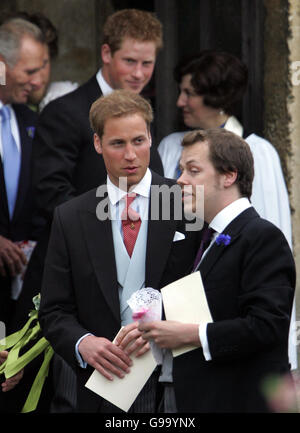 Prince William and Prince Harry (behind ) talks to Tom Parker Bowes after the wedding of Laura Parker Bowles to Harry Lopes at St Cyriac's Church, Lacock, Wiltshire. Stock Photo