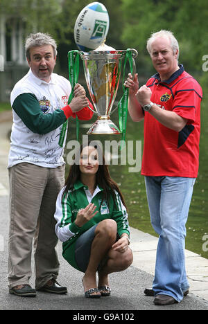 Pictured left to right are RTE Sports' Michael Corcoran, model Andrea Roche and fellow presenter John Kenny with the Heineken Cup in St Stephen's Green, Dublin. Stock Photo