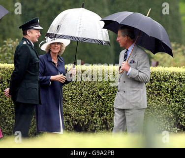 The Chief Constable of the Police Service of Northern Ireland, Sir Hugh Orde (left) at a garden party at Hillsborough Castle with the Prince of Wales and the Duchess of Cornwall. Stock Photo