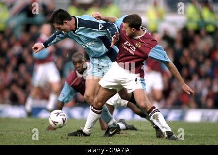 Soccer - AXA FA Cup - Fourth Round - Coventry City v Burnley. Coventry City's Cedric Roussel takes on Andy Cooke Stock Photo