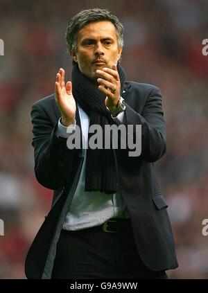 Chelsea manager Jose Mourinho applauds his players on the touchline ...