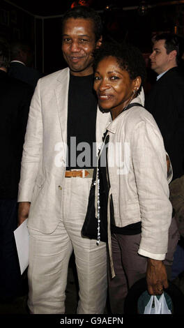 Actor Hugh Quarshie (L) and one of the producers of the play Bonnie Greer arrive for the press night of 'Road to Nirvana', at the Kings Head, north London. Stock Photo