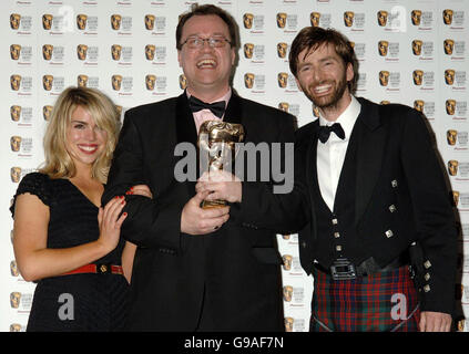Stars of Dr Who (which won the award for Best Drama Series), Billie Piper (left) and David Tennant (right) with writer Russell T.Davis, during the TV Baftas, at the Grosvenor House Hotel in central London. Stock Photo