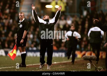 Coventry City manager Gordon Strachan throws his arms in the air up in despair at his team's performance Stock Photo