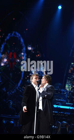 Gary Barlow (L) and Mark Owen perform with Take That at Wembley Arena, north London. Stock Photo