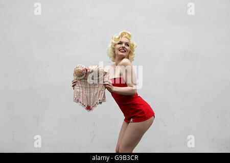 Marilyn Monroe look-a-like Suzie Kennedy holds the Hollywood siren's georgian cotton style bustier from Billy Wilder's 'Some Like it Hot', at Bonhams auctioneers, Knightsbridge, London, where it is to auctioned later this month. Stock Photo