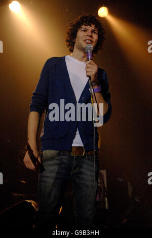 Simon Amstell performs at the Big Ask Live Benefit Concert on at Koko in Camden, north London.. Simon Amstell performs at the Big Ask Live Benefit Concert on at Koko in Camden, north London. Stock Photo