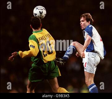 Soccer - Nationwide League Division One - Blackburn Rovers v Norwich City. Blackburn Rovers' Jason McAteer (r) lifts the ball past Norwich City's Chris Llewellyn (l) Stock Photo