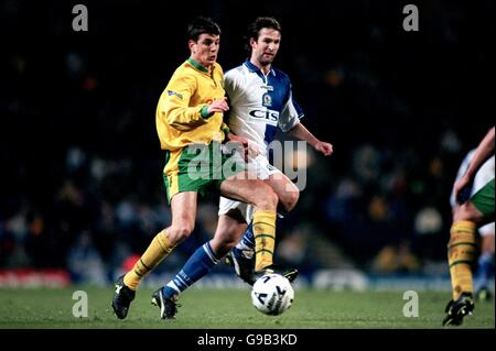 Blackburn Rovers' Simon Grayson (r) and Norwich City's Chris Llewellyn (l) Stock Photo