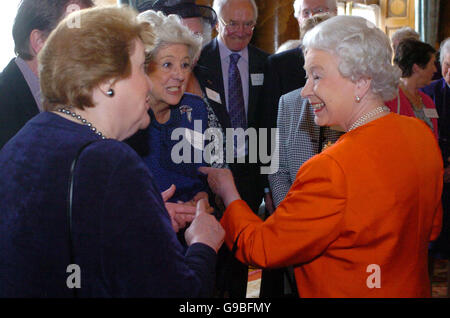 Queen Elizabeth II meets Baroness Boothroyd and Patricia Routledge (left) - better known as Hyacinth in the television sitcom Keeping Up Appearances - inside the Blue Drawing Room at Buckingham Palace, during a reception for those 'Serving Beyond Sixty'. Stock Photo