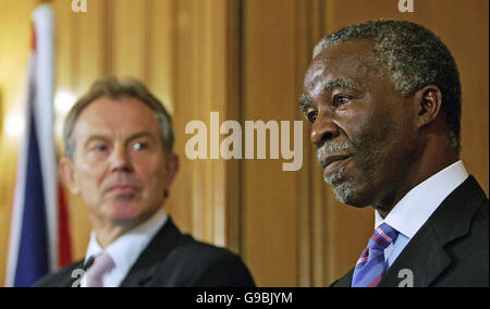 British Prime Minister Tony Blair (left) watches as South African President Thabo Mbeki speaks during a press conference inside Downing Street, central London. Stock Photo