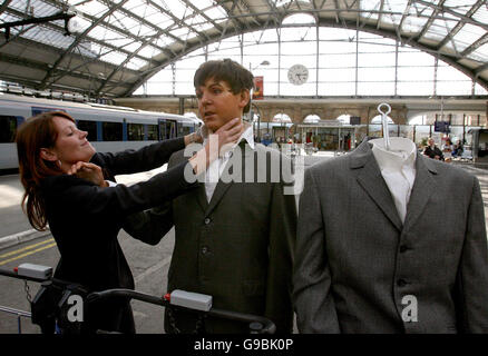 Louise Collier prepairs Waxworks of The Beatles as they arrive at Lime Street Station in Liverpool. PRESS ASSOCIATION Photo. Picture date: Wednesday 24 May 2006. The first ever wax models from the Hard Day's Night era are going to the Beatles Story museum in Liverpool. PRESS ASSOCIATION Photo. Photo credit should read: Martin Rickett/PA Stock Photo