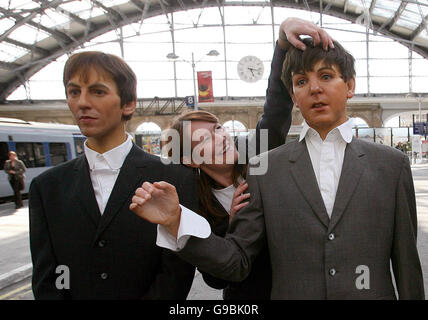 Louise Collier prepairs Waxworks of The Beatlesas they arrive at Lime Street Station in Liverpool. PRESS ASSOCIATION Photo. Picture date: Wednesday 24 May 2006. The first ever wax models from the Hard Day's Night era are going to the Beatles Story museum in Liverpool. PRESS ASSOCIATION Photo. Photo credit should read: Martin Rickett/PA Stock Photo