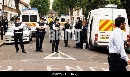 Police block off Lansdown Road, in Forest Gate, East London, the scene of a shooting in the early hours of this morning. Stock Photo