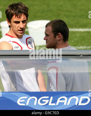 England and Manchester United team-mates Gary Neville (L) and Wayne Rooney during a training session at the Franken-Stadion in Nuremberg, Germany. Stock Photo