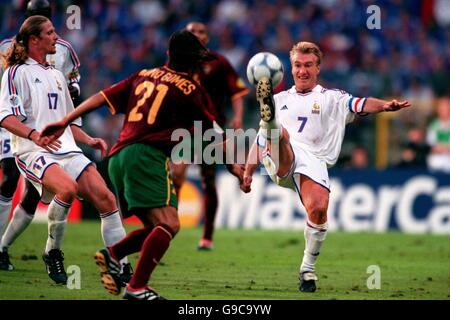 France's Didier Deschamps (r) controls the ball ahead of Nuno Gomes of Portugal (c) Stock Photo